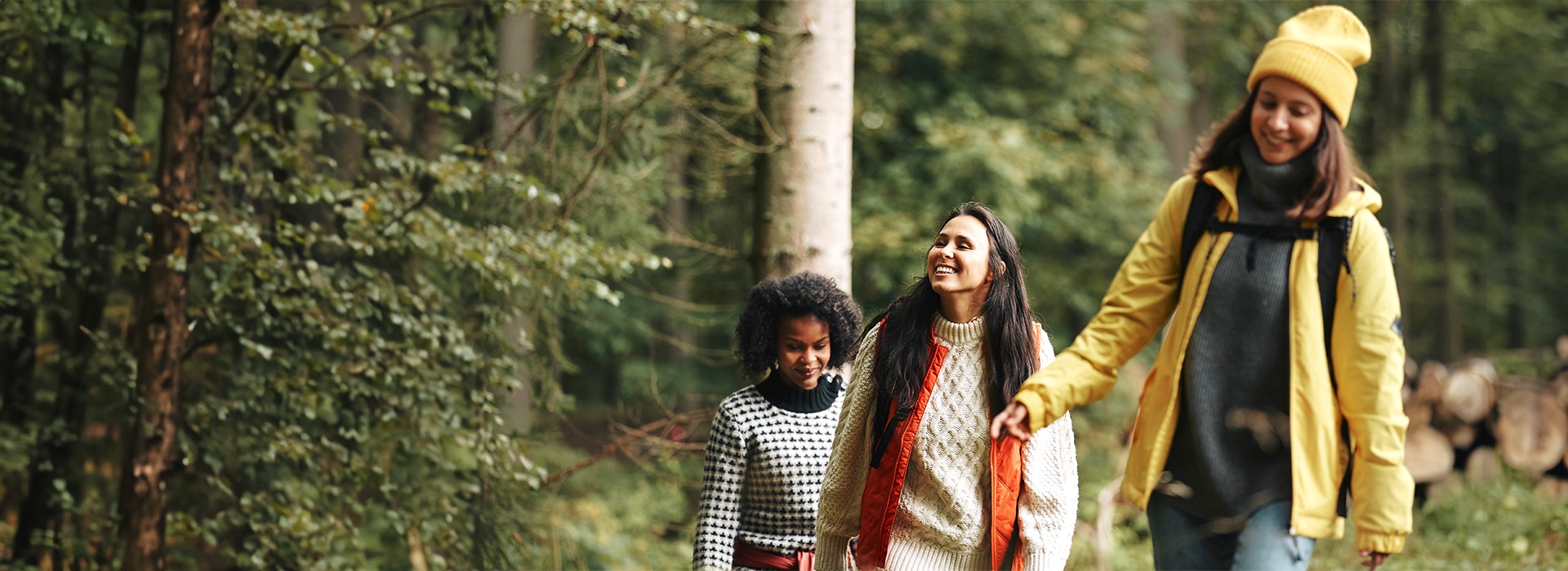 Friends walking in woods