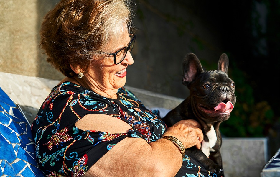 Older woman holding her dog