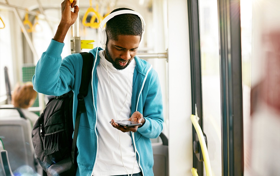 Man using technology on bus