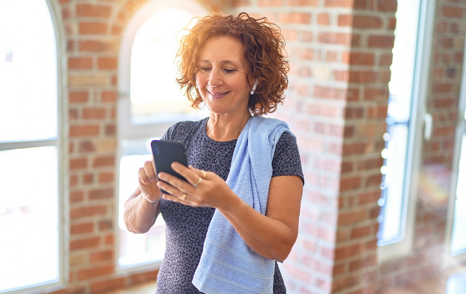 Woman using phone in activity