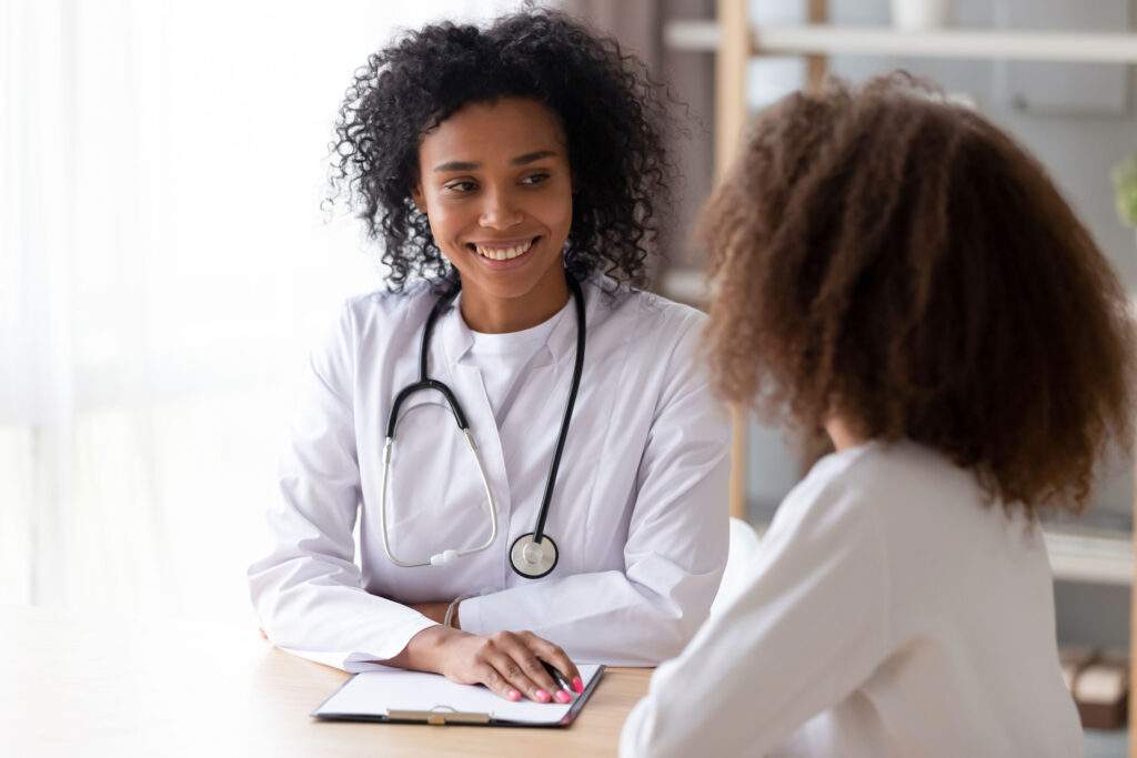 Healthcare professional talking to child